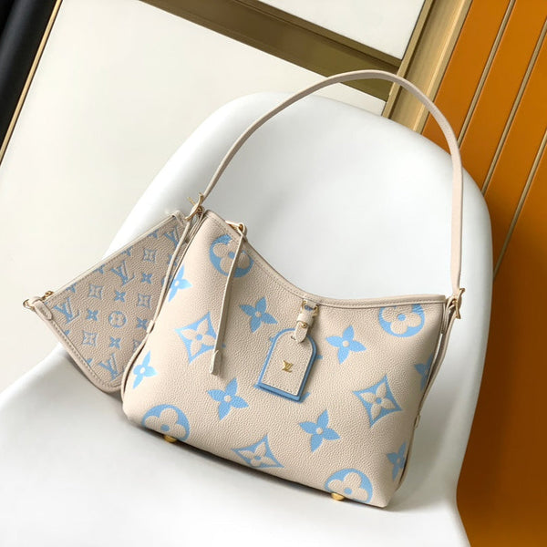 CARRYALL PM 29 BAG IN BEIGE MIX BLUE MONOGRAM EMPREINTE LEATHER